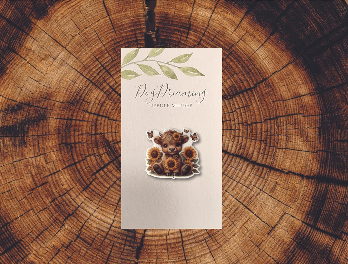 Sweet baby Highland cow needle minder with sunflower crown and butterflies