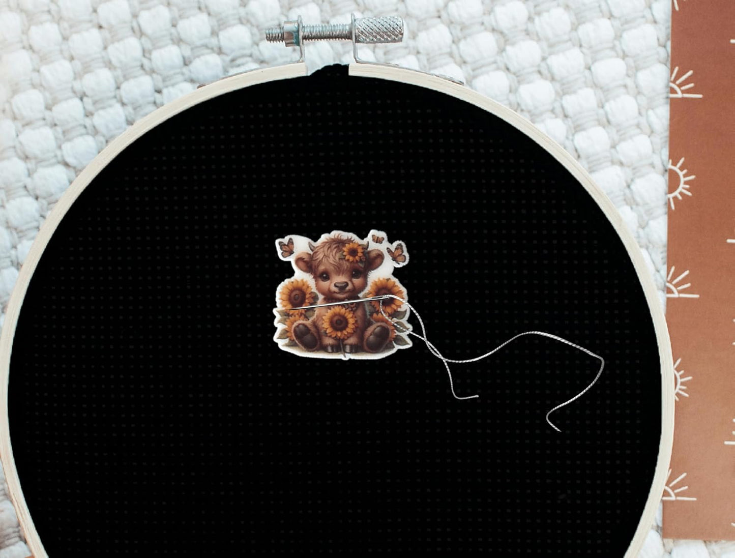 Sweet baby Highland cow needle minder with sunflower crown and butterflies