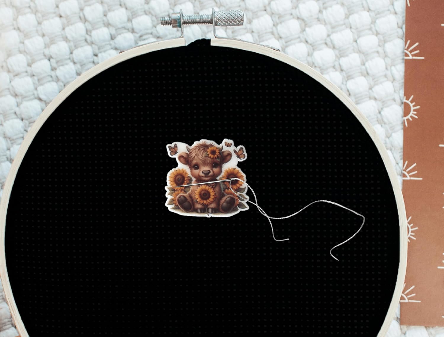 Sweet baby Highland cow needle minder with sunflower crown and butterflies