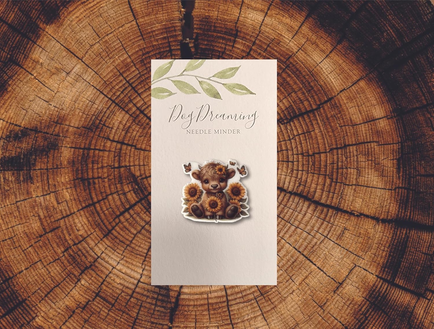 Sweet baby Highland cow needle minder with sunflower crown and butterflies