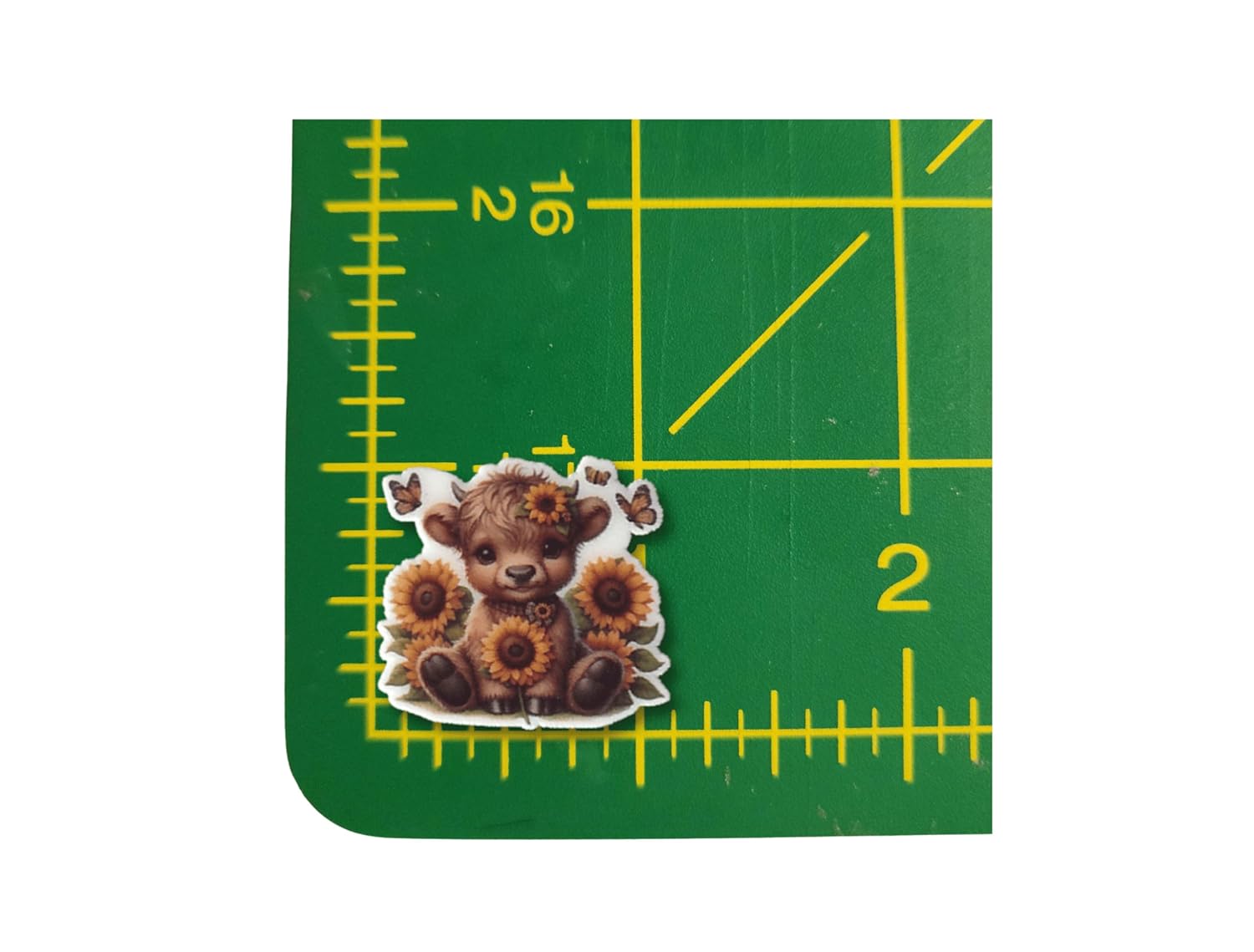 Sweet baby Highland cow needle minder with sunflower crown and butterflies