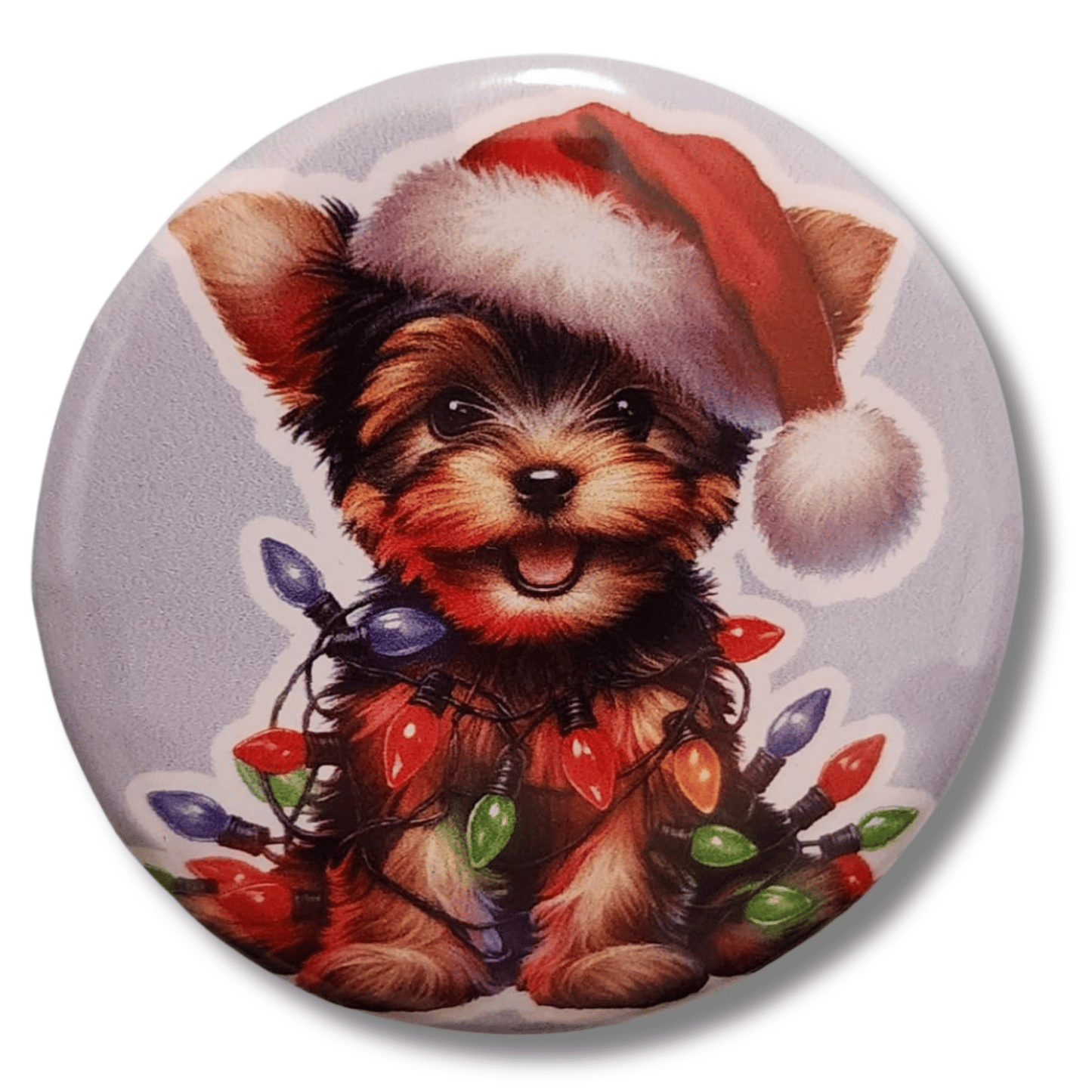 Christmas Yorkie magnetic needle minder featuring a Yorkshire Terrier wearing a Santa hat and wrapped in colorful holiday lights