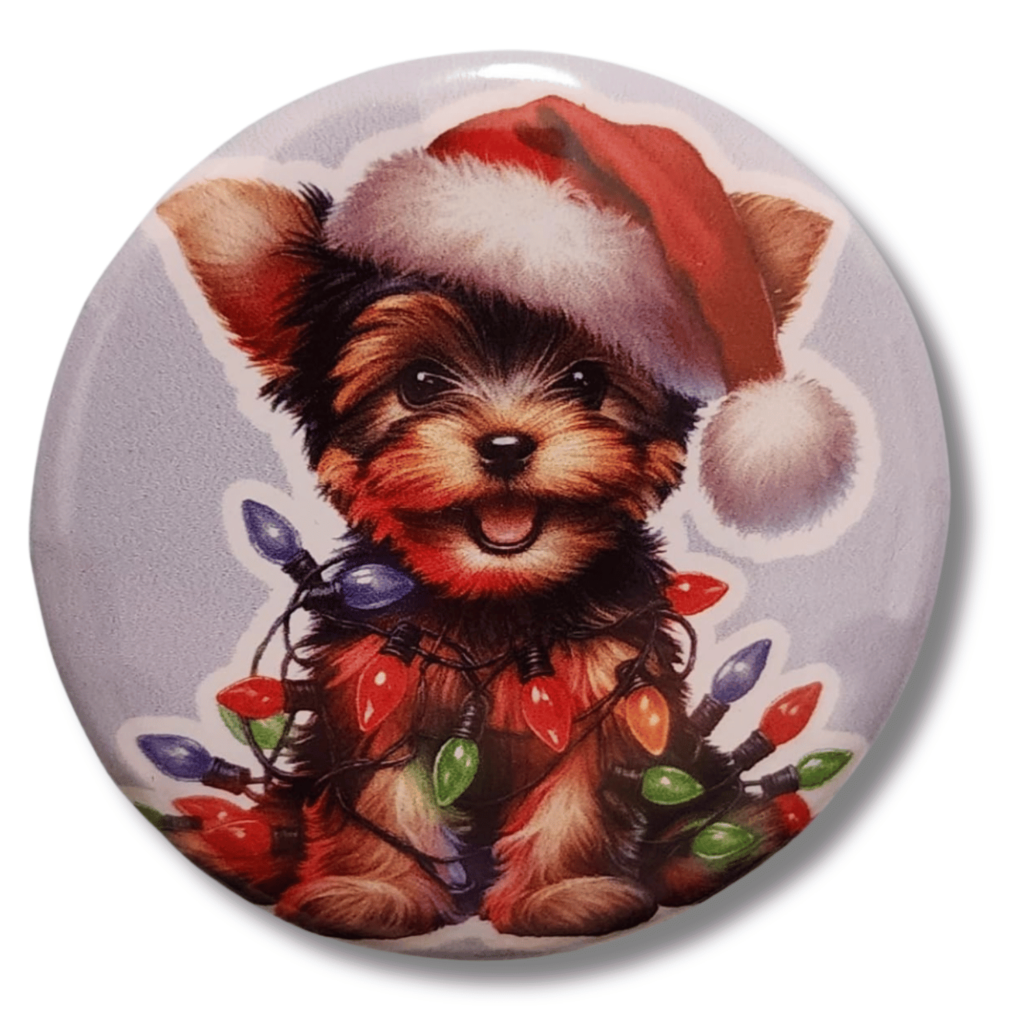 Christmas Yorkie magnetic needle minder featuring a Yorkshire Terrier wearing a Santa hat and wrapped in colorful holiday lights