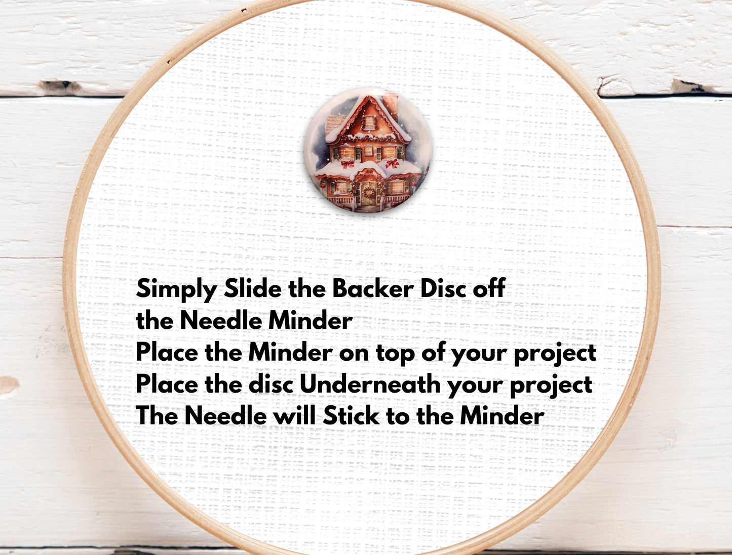 Holiday gingerbread house magnetic needle holder with warm lit windows and winter snowfall detail