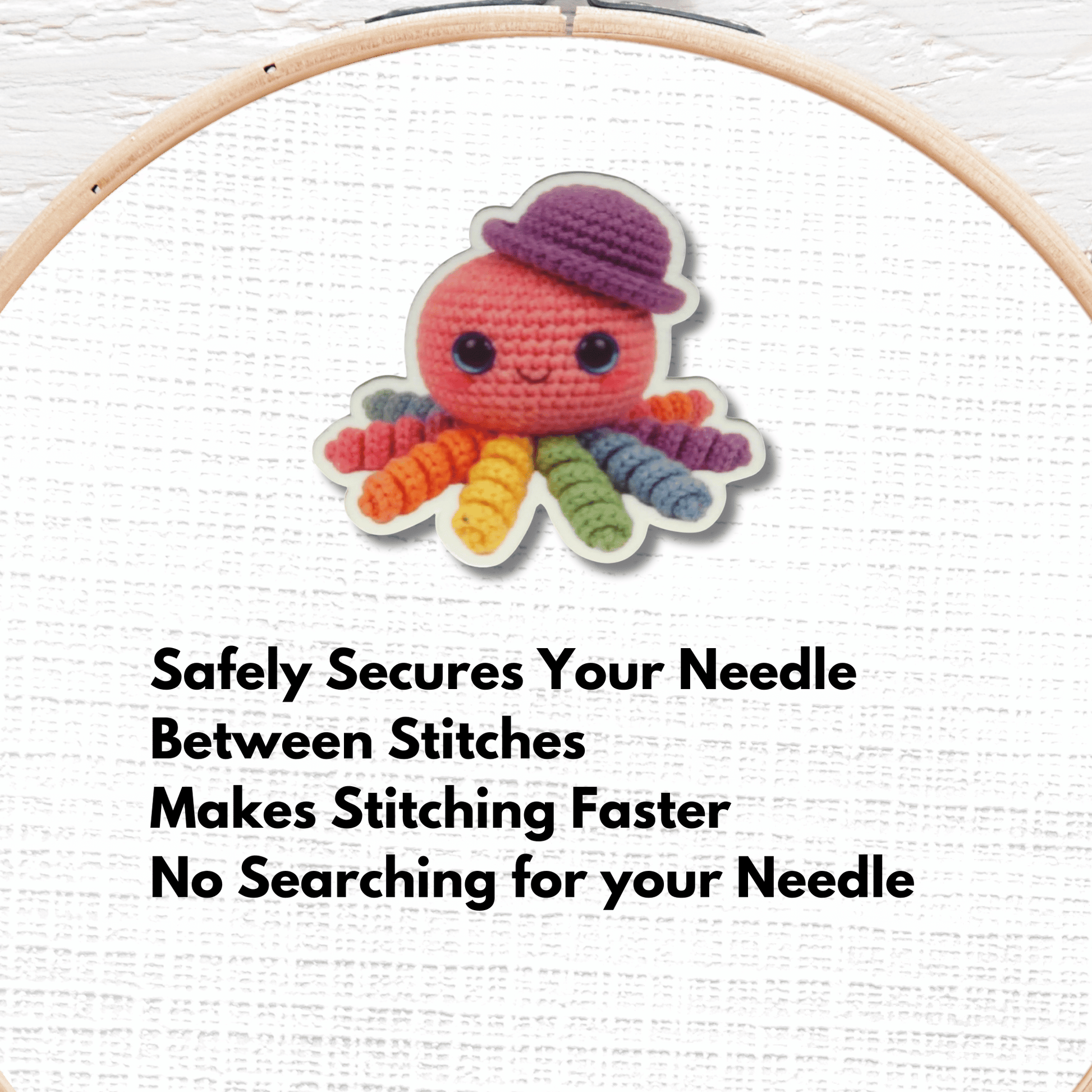 Cute rainbow octopus magnetic needle minder in crochet style with a purple hat for cross stitch projects
