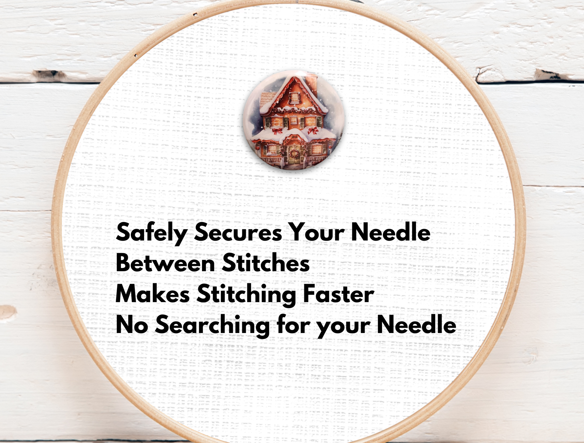 Christmas cottage needle minder featuring a cozy gingerbread-style home decorated with wreath and snow