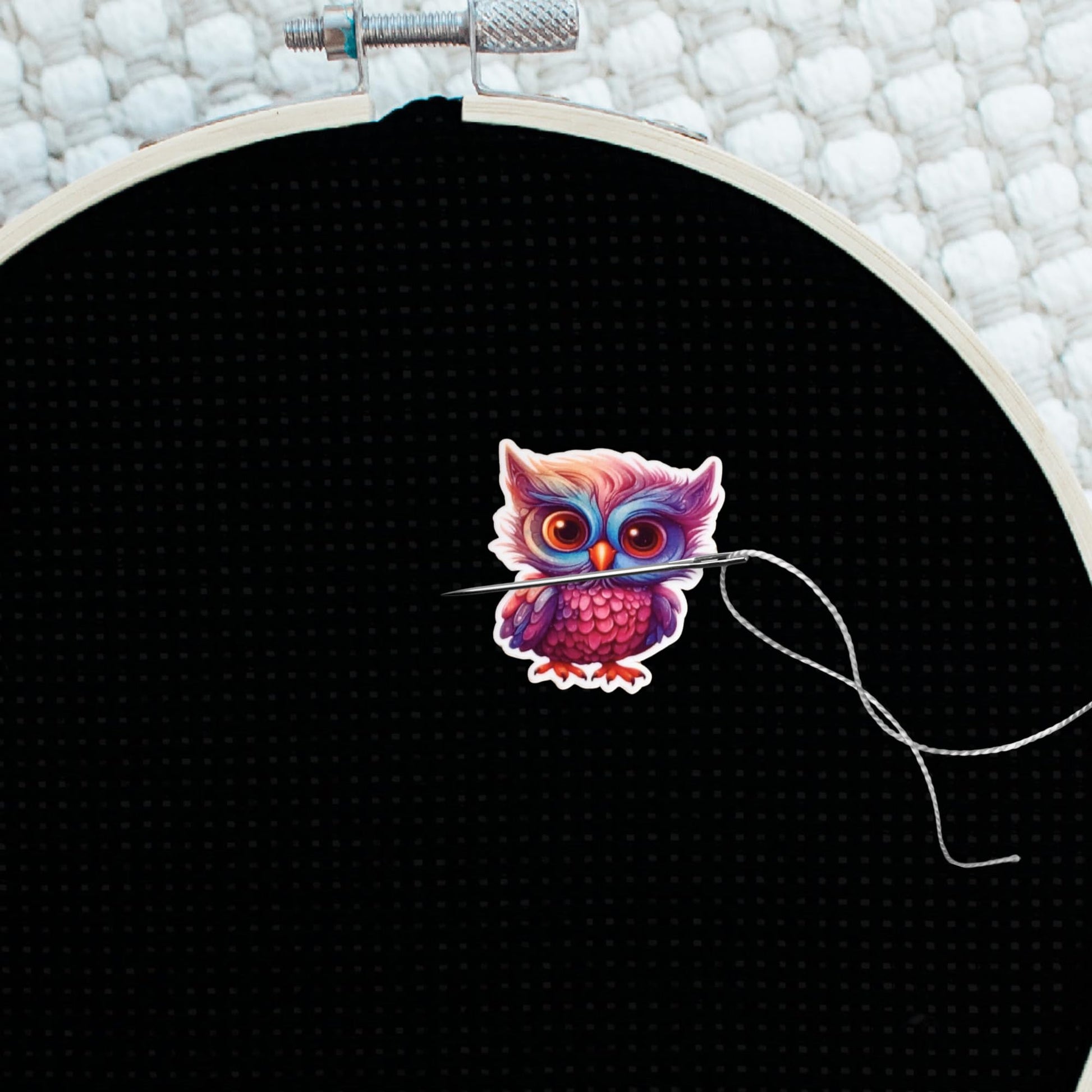 Bright purple and blue owl needle holder with oversized sparkling eyes