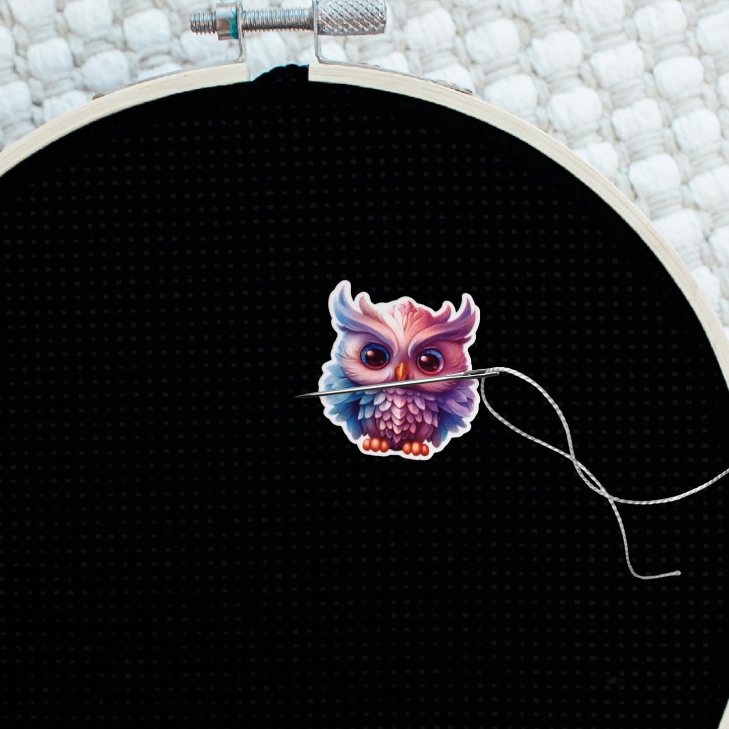 Adorable owl sewing accessory with layered feather details